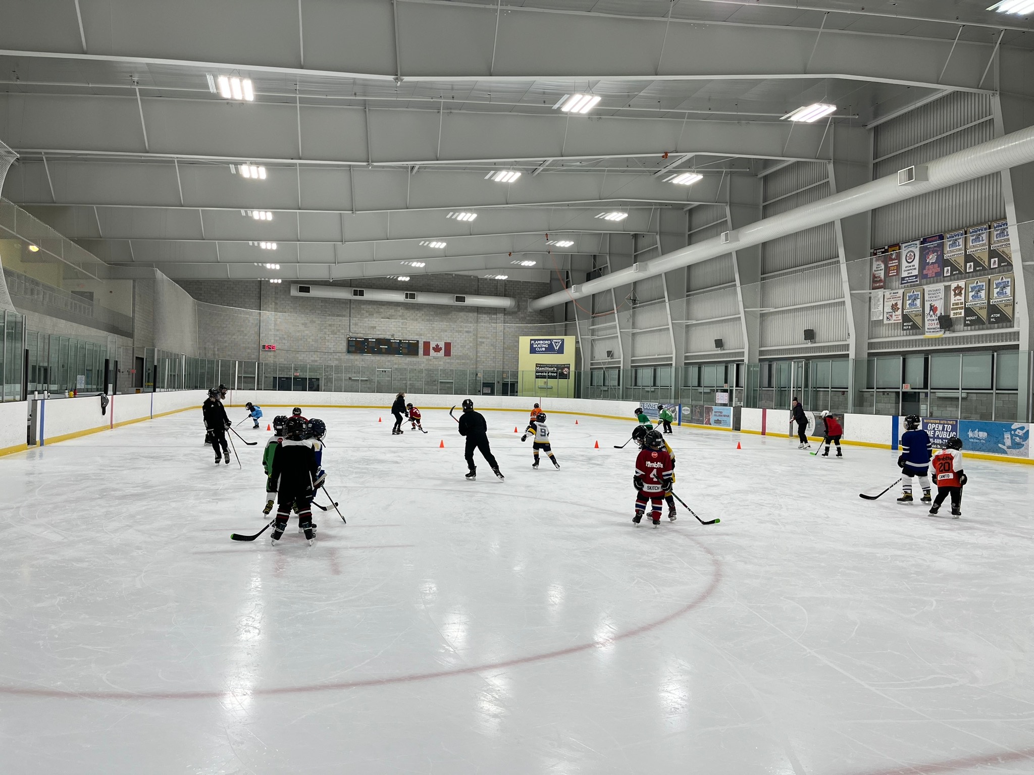 flamboro skating club lesson with hockey sticks