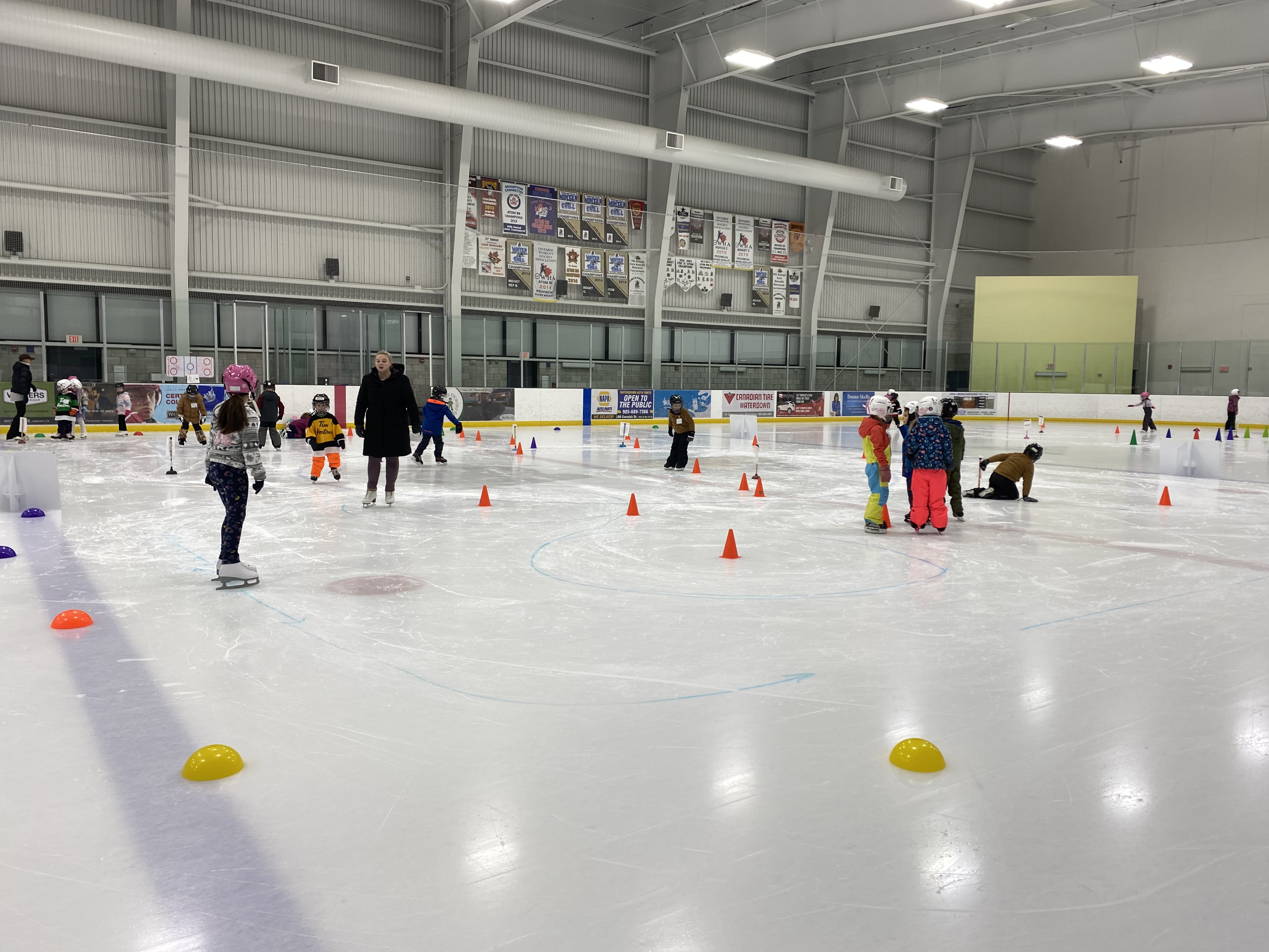 kids at flamboro skating club skating around obstacles